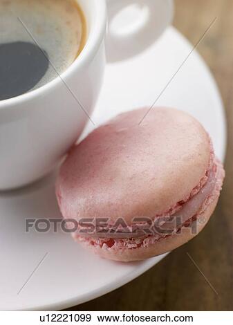 Stock Photo - Raspberry Macaroon with a Cup of Espresso. Fotosearch