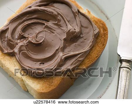 Stock Photograph - Slice of Toasted brioche with Chocolate Spread. Fotosearch