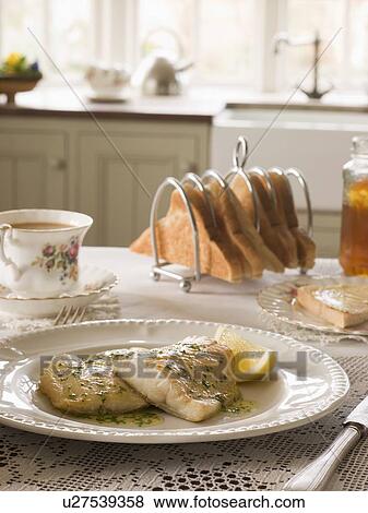 Smoked Haddock with Herb Butter and Toast View Large Photo Image Stock Photo - Smoked Haddock with Herb Butter and Toast. Fotosearch