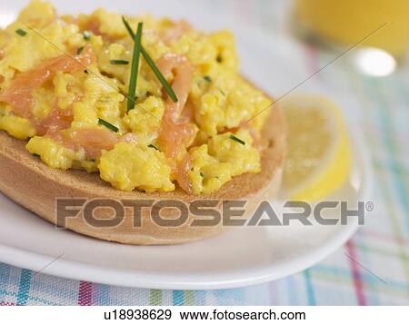Stock Photo - Smoked Salmon Scrambled Egg on a Toasted Bagel. Fotosearch