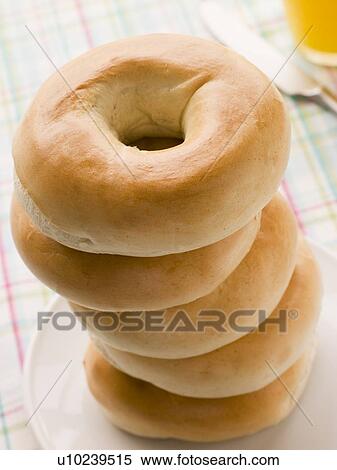 Stack of Plain Bagels with a Glass of Orange Juice View Large Photo Image Stock Photography - Stack of Plain Bagels with a Glass of Orange Juice. Fotosearch