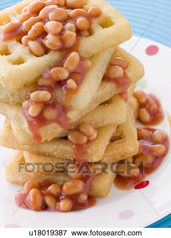 Stock Photo - Stack of Potato Waffles with Baked Beans. Fotosearch