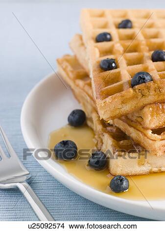 Waffles with Caramel Syrup and Blueberries View Large Photo Image Picture - Waffles with Caramel Syrup and Blueberries. Fotosearch