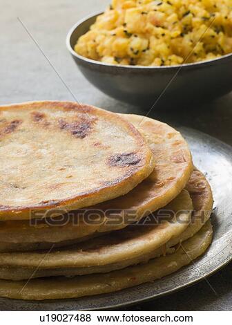Stock Photo - Aloo stuffed Parathas. Fotosearch