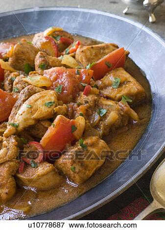 Stock Photo - Chicken Bhoona in a Pewter dish. Fotosearch