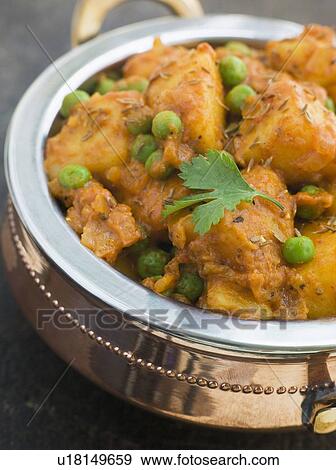 Curried Potatoes Peas and Cumin View Large Photo Image Stock Photo - Curried Potatoes Peas and Cumin. Fotosearch