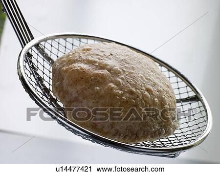 Deep Fried Puff Bread on a Strainer View Large Photo Image Stock Image - Deep Fried Puff Bread on a Strainer. Fotosearch