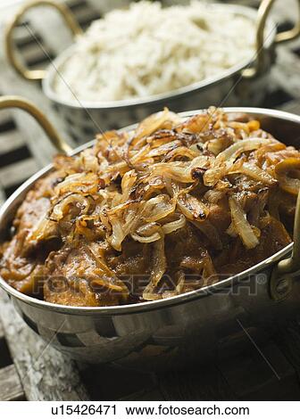 Stock Image - Dish of Dopiaza Veal with Fragrant Pilau Rice. Fotosearch
