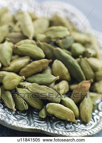 Stock Photography - Dish of Green Cardamom Pods. Fotosearch