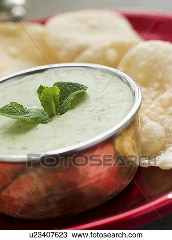 Fresh Green Yoghurt Chutney with mini Papadoms View Large Photo Image Stock Image - Fresh Green Yoghurt Chutney with mini Papadoms. Fotosearch