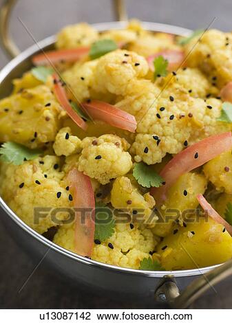 Stock Image - Gobi Aloo - Spiced Cauliflower and Potato. Fotosearch