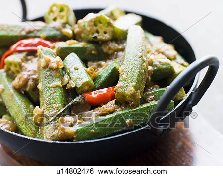 Stock Photograph - Karahi Dish with Bhindi Masala. Fotosearch