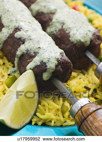 Lamb Mint and Garlic Sheesh Kebab with Pilau Rice and Raita View Large Photo Image Stock Image - Lamb Mint and Garlic Sheesh Kebab with Pilau Rice and Raita. Fotosearch