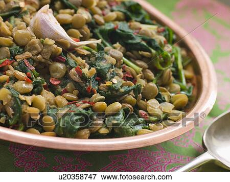 Stock Photo - Lentils with spinach and Garlic. Fotosearch