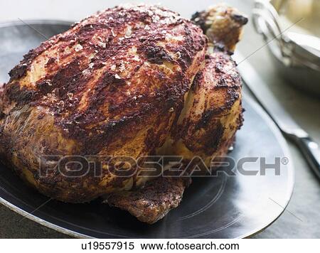 Stock Photography - Roast Tandoori Chicken stuffed with Keema. Fotosearch