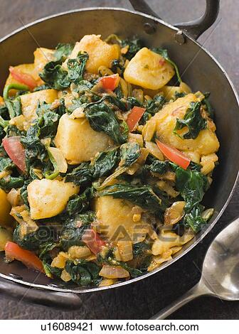 Stock Image - Sag Aloo in a Karai Pan. Fotosearch