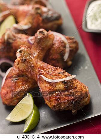 Tandoori Style Baked Chicken Drumsticks View Large Photo Image Picture - Tandoori Style Baked Chicken Drumsticks. Fotosearch