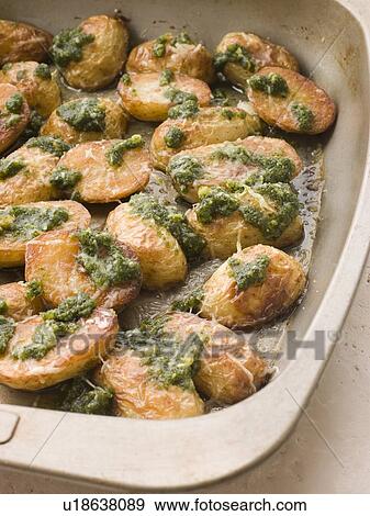 Baby Potatoes roasted with Pesto View Large Photo Image Stock Photo - Baby Potatoes roasted with Pesto. Fotosearch