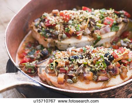 Stock Photo - Baked Sicilian Swordfish in a Copper pan. Fotosearch