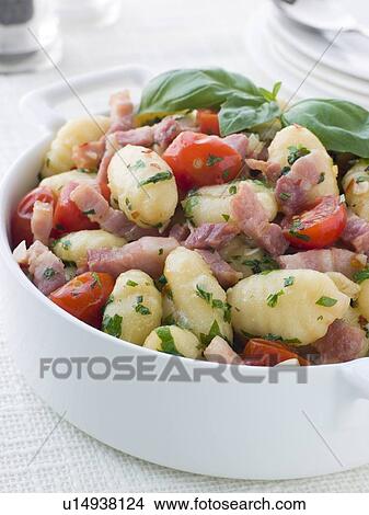 Picture - Bowl of Gnocchi with a Bacon Tomato and Basil Dressing. Fotosearch