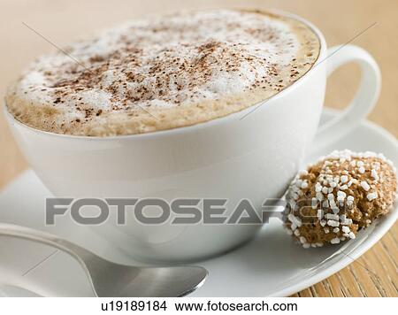 Cup of Cappucino with an Amaretti Biscuit View Large Photo Image Picture - Cup of Cappucino with an Amaretti Biscuit. Fotosearch