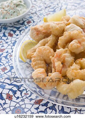 Stock Photo - Dish of Fritto Misto di mare with Herb Dressing. Fotosearch