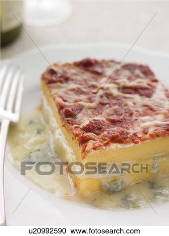 Stock Image - Four Cheese Baked Polenta. Fotosearch