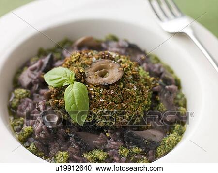 Herb Crusted Portabello Mushroom with Red Wine Risotto and Pesto Dressing View Large Photo Image Stock Image - Herb Crusted Portabello Mushroom with Red Wine Risotto and Pesto Dressing. Fotosearch