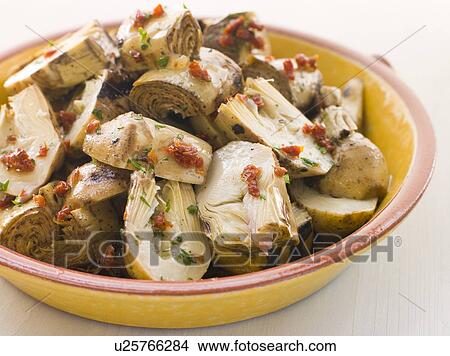 Marinated Baby Artichoke Salad with Sun Dried Tomatoes View Large Photo Image Picture - Marinated Baby Artichoke Salad with Sun Dried Tomatoes. Fotosearch