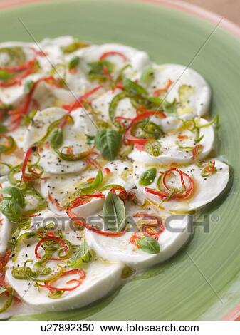 Stock Image - Mozzarella Cheese and Roasted Chilli Salad. Fotosearch