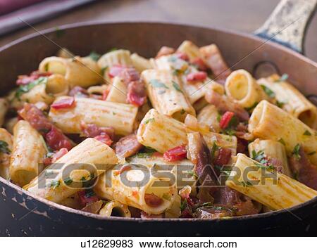 Pan of Rigatoni Pasta with Tomato and Pancetta Sauce View Large Photo Image Stock Image - Pan of Rigatoni Pasta with Tomato and Pancetta Sauce. Fotosearch