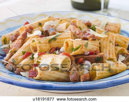 Rigatoni Pasta with a Tomato and Pancetta Sauce View Large Photo Image Stock Photo - Rigatoni Pasta with a Tomato and Pancetta Sauce. Fotosearch