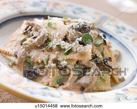 Sagnarelli Pasta with Beef Fillet Strips in a Tomato and Olive Cream Sauce View Large Photo Image Stock Photo - Sagnarelli Pasta with Beef Fillet Strips in a Tomato and Olive Cream Sauce. Fotosearch