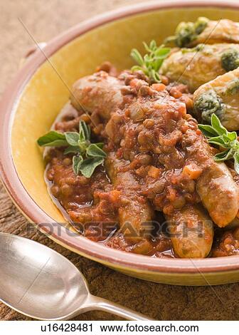 Stock Image - Sausage and Lentil Stew with Pesto Roasted Potatoes. Fotosearch