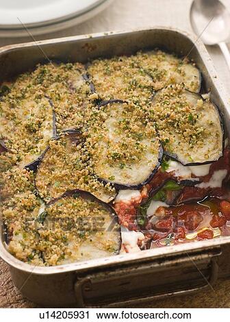 Stock Image - Tray of Aubergine Parmigiana. Fotosearch