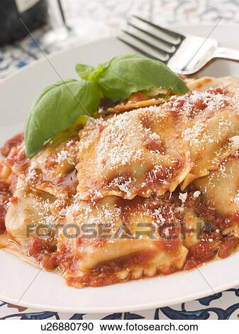 Veal and Sage Ravioli with Tomato and Basil Sauce with Grated Parmesan View Large Photo Image Stock Image - Veal and Sage Ravioli with Tomato and Basil Sauce with Grated Parmesan. Fotosearch