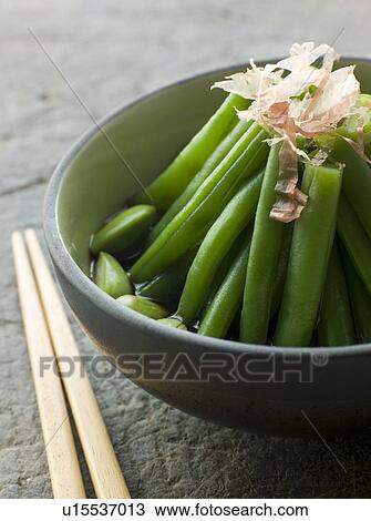 Stock Image - Bowl of Simmered Beans And Bonito Flakes. Fotosearch