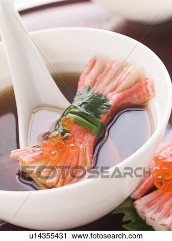Stock Image - Clear Soup with Snow Crab Sticks. Fotosearch