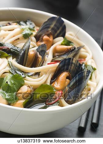 Stock Photo - Mussels and Udon Noodles in Chili Soy Broth. Fotosearch