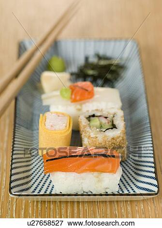 Stock Photo - Plated Sushi with Wasabi Sushi Ginger and nori. Fotosearch