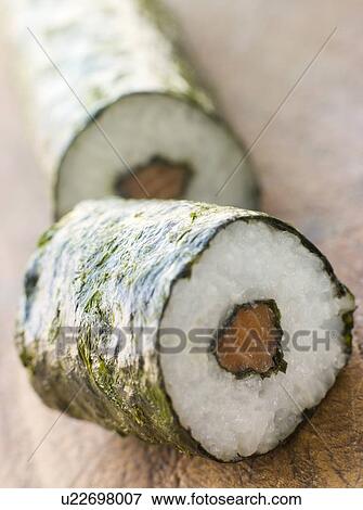 Roll of Salmon Sushi on a Board View Large Photo Image Stock Photo - Roll of Salmon Sushi on a Board. Fotosearch