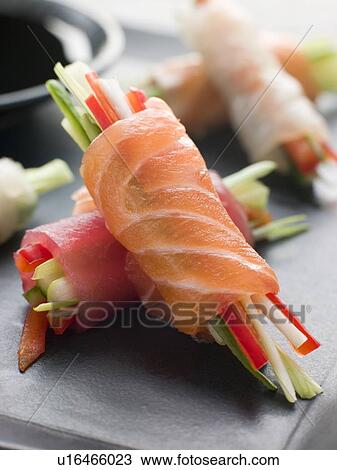 Stock Image - Sashimi and Vegetable Rolls with Soy Sauce. Fotosearch