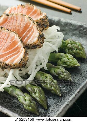 Stock Photograph - Seared Salmon SashimiBlack Pepper with a Mouli and Asparagus Salad. Fotosearch