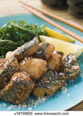 Stock Photography - Spiced Fried Mackerel with Lemon. Fotosearch