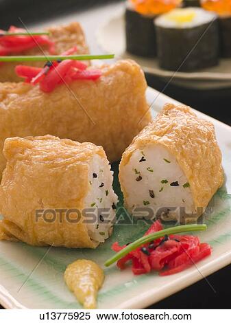 Stock Photography - Sushi Tofu Pouches with Red Pickled Ginger. Fotosearch