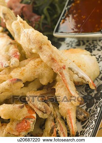 Stock Image - Tempura of Soft Shell Crab with Chili Sauce and Seaweed salad. Fotosearch
