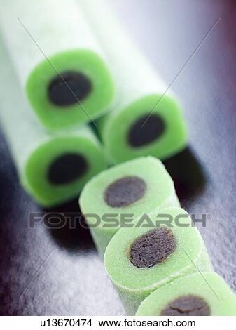 Picture - Whole and Sliced Jade Rolls. Fotosearch