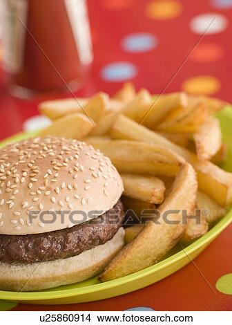 Beefburger in a Sesame Seed Bun with Chunky Chips View Large Photo Image Picture - Beefburger in a Sesame Seed Bun with Chunky Chips. Fotosearch