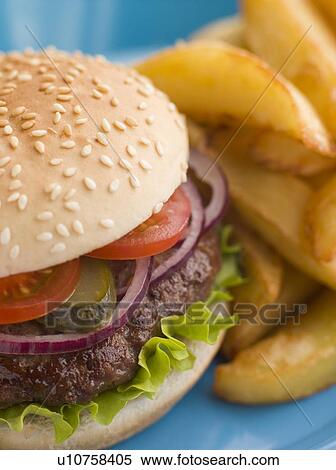 Beefburger with Salad and Pickles in a Sesame Seed Bun with Chips View Large Photo Image Stock Photography - Beefburger with Salad and Pickles in a Sesame Seed Bun with Chips. Fotosearch