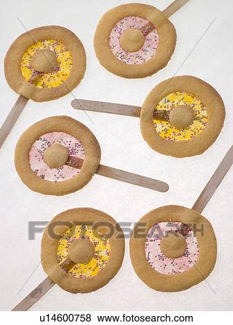 Stock Photo - Candy and Shortbread Biscuit Lollipops. Fotosearch